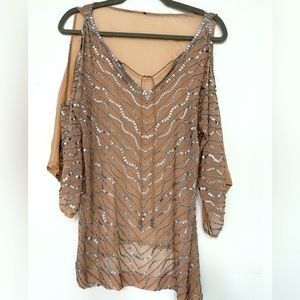 Nude sheer embellished top.